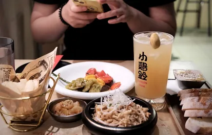 Person ordering from phone at restaurant table