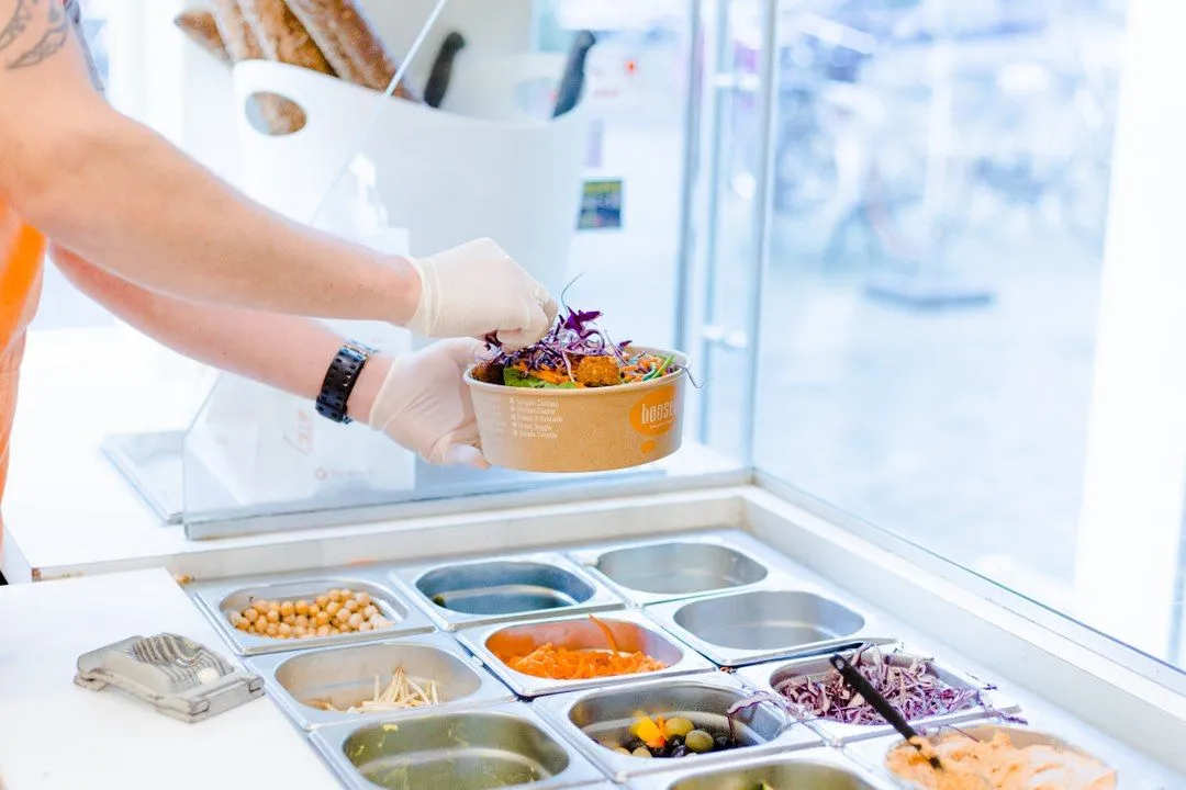 A Boosty team member in The Hague prepares a bowl.